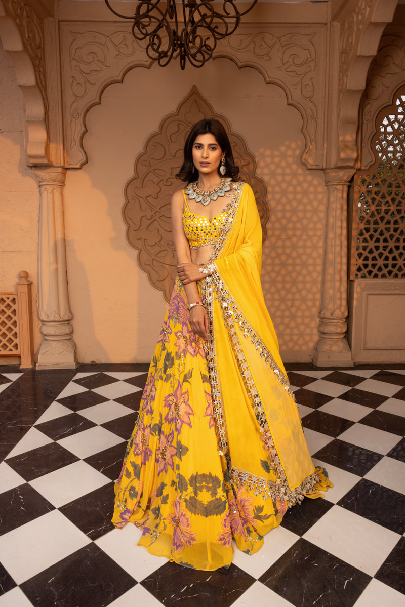 YELLOW FLORALS PRINTED LEHENGA WITH EMBROIDERED BUSTIER AND DUPATTA