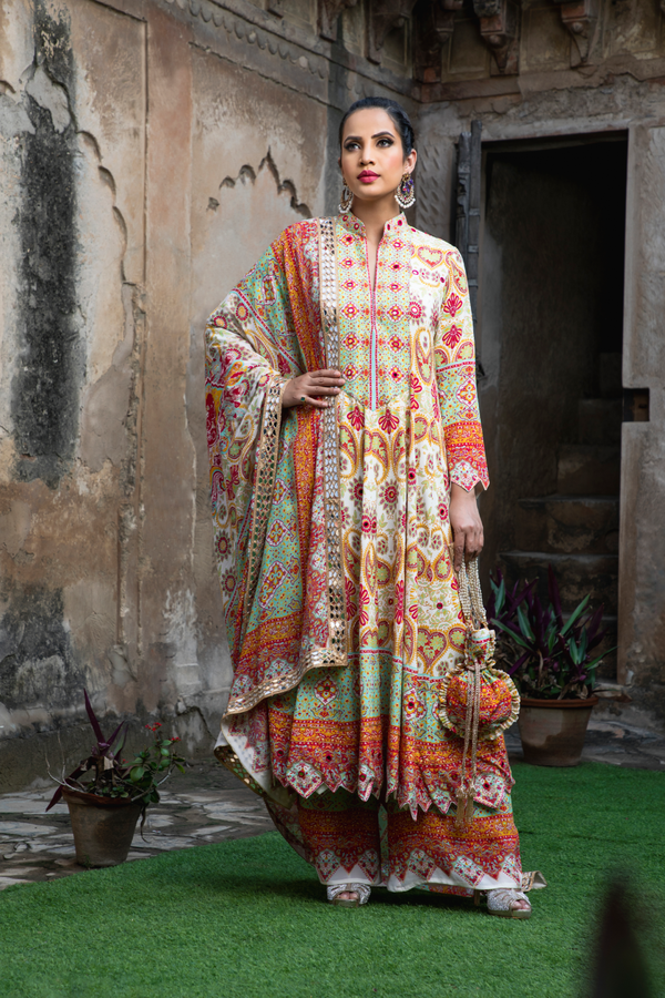 IVORY & RED PRINTED KALIDAR ANARKALI SET WITH POTLI BAG