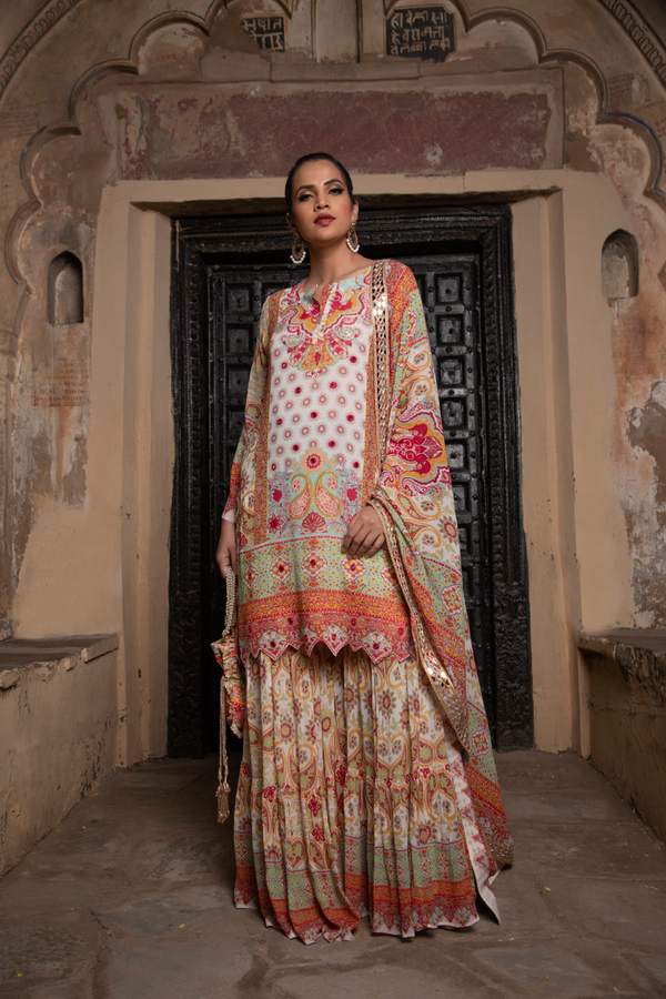 IVORY & RED PRINTED SHARARA SET WITH POTLI BAG