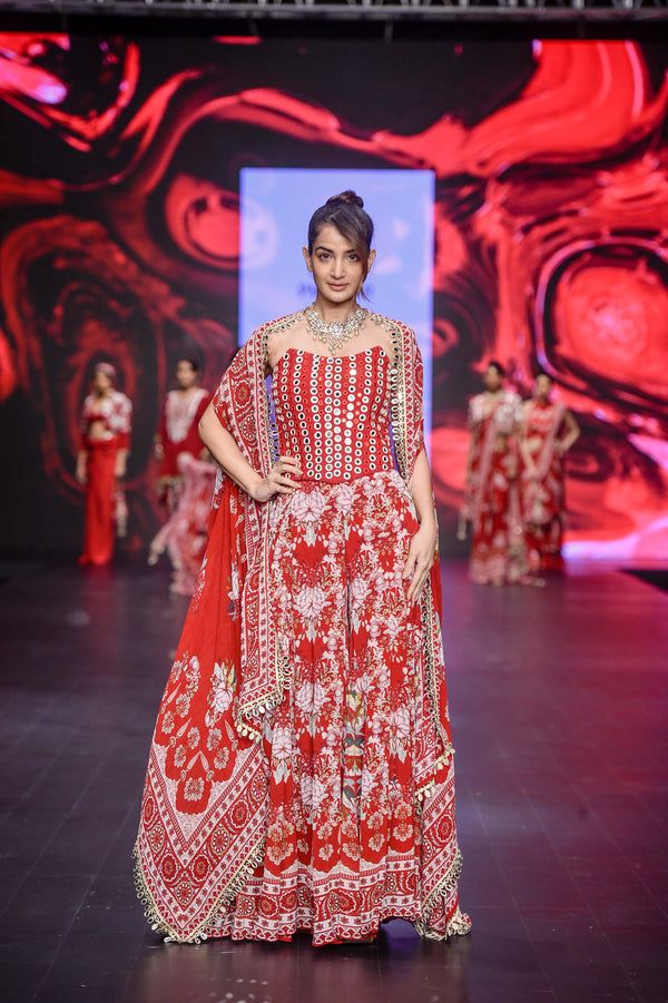 RED FLORAL PRINTED FLARE PANTS WITH MIRRORWORK CORSET AND CAPE
