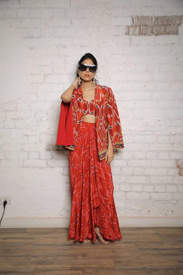 RED IKKAT PRINTED CAPE WITH BUSTIER AND SELF PRINTED SKIRT